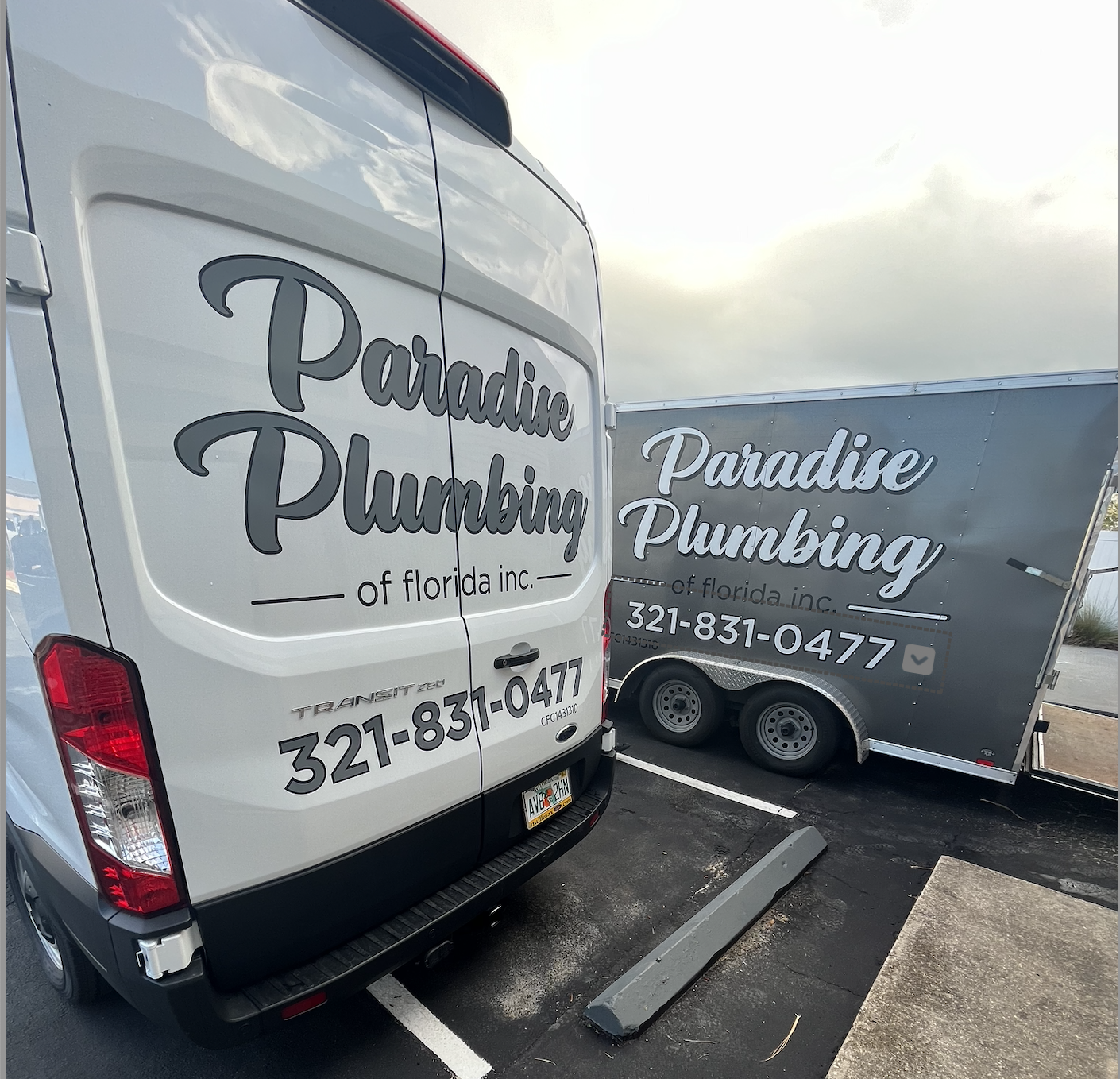 Paradise Plumbing of Florida branded service vans